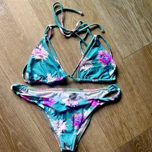 O’Neil floral bikini. Worn and loved but still has life left in it! Size Large